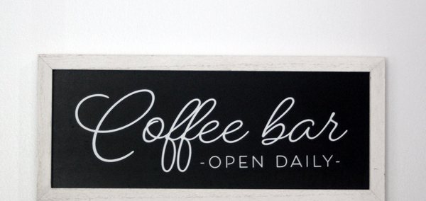 Coffee bar sign in the waiting area at COVE in New Albany
