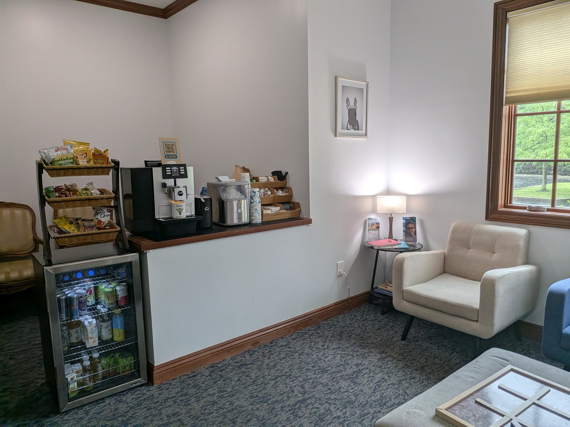 Comfortable seating with a coffee and snack bar in the reception area at Central Ohio Vision and Eyecare in New Albany
