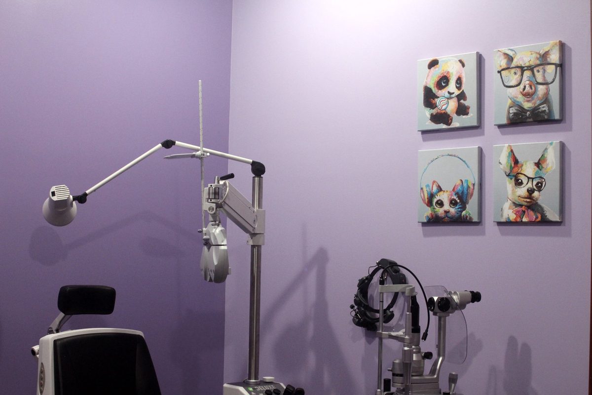 Pediatric eye exam room at Central Ohio Vision and Eyecare in New Albany with playful animals-in-glasses artwork